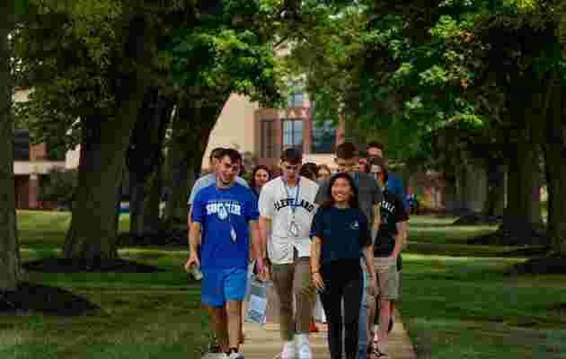 OCU students walking on campus for a tour
