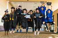 Graduates Jumping with Diploma