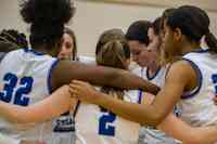 Trailblazer students in women's Basketball huddle