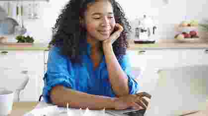 Student on laptop doing online study for human resources degree program