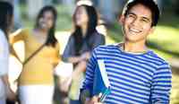 Trailblazer Academy Student with Book on Campus